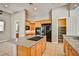 Well-equipped kitchen featuring granite countertops, stainless appliances, and wooden cabinets at 213 Villa Borghese St, Las Vegas, NV 89138