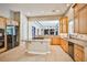 Stylish kitchen with stainless steel appliances and granite countertops open to the living room at 213 Villa Borghese St, Las Vegas, NV 89138