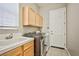 Well-equipped laundry room with modern appliances and ample storage at 213 Villa Borghese St, Las Vegas, NV 89138