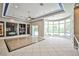 Living room with fireplace, shelving, and large windows with backyard views at 213 Villa Borghese St, Las Vegas, NV 89138