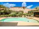 Beautiful pool and spa with lush landscaping and privacy wall in the backyard at 213 Villa Borghese St, Las Vegas, NV 89138