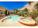 Backyard pool and spa surrounded by lush landscaping at 213 Villa Borghese St, Las Vegas, NV 89138