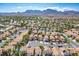Expansive aerial view of the neighborhood with lush landscaping and mountain backdrop at 2316 Pine Bluff Ct, Las Vegas, NV 89134