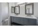 Bathroom featuring double sink vanity with two mirrors, and updated fixtures at 2316 Pine Bluff Ct, Las Vegas, NV 89134