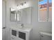 Bathroom features a modern vanity, decorative lighting, and a view from the window at 2316 Pine Bluff Ct, Las Vegas, NV 89134