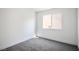 Bright bedroom with neutral carpet and a window with natural light at 2316 Pine Bluff Ct, Las Vegas, NV 89134