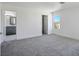 Spacious bedroom featuring a neutral carpet, with ensuite bathroom and walk-in closet at 2316 Pine Bluff Ct, Las Vegas, NV 89134