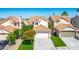 Charming two-story home with a tile roof, two-car garage, and well-maintained landscaping at 2316 Pine Bluff Ct, Las Vegas, NV 89134