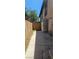 Backyard featuring a concrete patio, a wooden fence, and a large refrigerator at 236 N Bruce St # C, Las Vegas, NV 89101