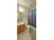 Bathroom with tub/shower combo and wood vanity at 236 N Bruce St # C, Las Vegas, NV 89101