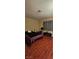 Bedroom featuring wood flooring and a window at 236 N Bruce St # C, Las Vegas, NV 89101