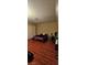 Bedroom with laminate flooring and neutral walls at 236 N Bruce St # C, Las Vegas, NV 89101