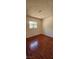 Bright bedroom featuring hardwood floors and a window offering natural light at 236 N Bruce St # C, Las Vegas, NV 89101
