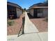 Apartment exterior showcasing building numbers and walkway under a sunny sky at 236 N Bruce St # C, Las Vegas, NV 89101