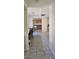 Classic kitchen features wood cabinetry, white appliances, and tile flooring at 236 N Bruce St # C, Las Vegas, NV 89101