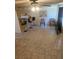 Neutral-toned living room featuring tile floors and bar stool seating at 236 N Bruce St # C, Las Vegas, NV 89101
