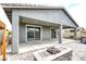 Cozy covered patio with a fireplace and spa in the backyard at 2395 Arrington Ave, North Las Vegas, NV 89086