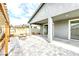 Cozy covered patio with a fireplace and spa in the backyard at 2395 Arrington Ave, North Las Vegas, NV 89086