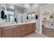 Bathroom featuring double sink vanity, tile floors, and an open closet at 2395 Arrington Ave, North Las Vegas, NV 89086