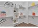 A walk-in closet with white shelving and hanging rods for ample storage at 2395 Arrington Ave, North Las Vegas, NV 89086