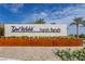 Del Webb North Ranch entrance sign with decorative landscaping under a blue sky at 2395 Arrington Ave, North Las Vegas, NV 89086