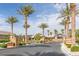 Gated entryway to the community with palm trees and landscaped surroundings at 2395 Arrington Ave, North Las Vegas, NV 89086