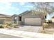 Charming single-story home with a well-maintained front yard and a two-car garage at 2395 Arrington Ave, North Las Vegas, NV 89086