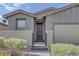 Charming single story home featuring a lovely landscaped front yard and gated entrance at 2395 Arrington Ave, North Las Vegas, NV 89086