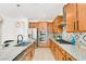 Eat in kitchen with granite countertops, stainless steel appliances, and patterned backsplash at 2395 Arrington Ave, North Las Vegas, NV 89086