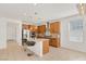 Bright eat-in kitchen featuring an island, stainless steel appliances, and decorative backsplash at 2395 Arrington Ave, North Las Vegas, NV 89086