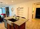 Kitchen island with granite countertops, undermount sink, and stainless steel dishwasher at 2395 Arrington Ave, North Las Vegas, NV 89086