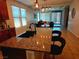 Kitchen island featuring granite countertops and seating, with pendant lighting at 2395 Arrington Ave, North Las Vegas, NV 89086
