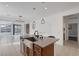 Bright kitchen featuring a granite island, stainless steel appliances, and ample counter space at 2395 Arrington Ave, North Las Vegas, NV 89086