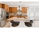 Bright and open kitchen with a large island, stainless steel appliances, and pendant lighting at 2395 Arrington Ave, North Las Vegas, NV 89086