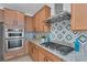 Updated kitchen featuring granite countertops, stainless steel appliances, and gas cooktop at 2395 Arrington Ave, North Las Vegas, NV 89086