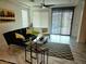 Comfortable living room featuring a ceiling fan, sliding glass doors, and stylish decor at 2395 Arrington Ave, North Las Vegas, NV 89086