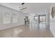 Open living room with tile flooring, recessed lighting, and large windows at 2395 Arrington Ave, North Las Vegas, NV 89086