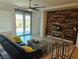 Inviting living room with stylish furniture, decor, and a sliding glass door to the backyard at 2395 Arrington Ave, North Las Vegas, NV 89086