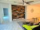 Spacious living room accented by a modern feature wall, decor, and sleek tile flooring at 2395 Arrington Ave, North Las Vegas, NV 89086