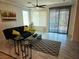 Bright living room featuring modern decor, sleek tile flooring, and plenty of natural light at 2395 Arrington Ave, North Las Vegas, NV 89086