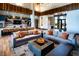 Bright, open lounge area with couches, modern lighting, and a kitchenette, perfect for relaxing at 2395 Arrington Ave, North Las Vegas, NV 89086