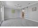 The main bedroom offers tile flooring, sliding glass door access, and a barn door to the bathroom at 2395 Arrington Ave, North Las Vegas, NV 89086