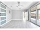 Spacious main bedroom with tile floors, neutral walls, and sliding door access to the patio at 2395 Arrington Ave, North Las Vegas, NV 89086