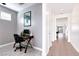Home office featuring a modern desk and a view down the tiled hallway at 2395 Arrington Ave, North Las Vegas, NV 89086