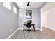 A home office area with tiled floors and a traditional-style desk at 2395 Arrington Ave, North Las Vegas, NV 89086