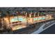 Aerial view of a resort-style pool and spa with palm trees and seating areas at 2395 Arrington Ave, North Las Vegas, NV 89086