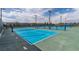 Well-maintained tennis courts with bright blue surface and professional nets at 2395 Arrington Ave, North Las Vegas, NV 89086