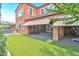 Backyard featuring synthetic grass, patio area, and access to the home at 2497 Birch Hollow St, Henderson, NV 89044