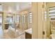 Bright bathroom with a glass-enclosed shower, vanity, toilet, and tile flooring at 2497 Birch Hollow St, Henderson, NV 89044