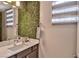 Bright bathroom with sleek vanity, quartz countertop, and modern fixtures at 2497 Birch Hollow St, Henderson, NV 89044